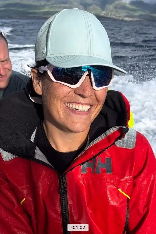 Emily McCulliss smiling on the water